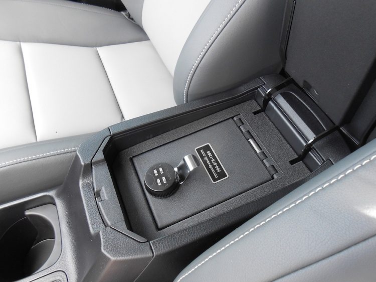 A car 's console with the center console open.